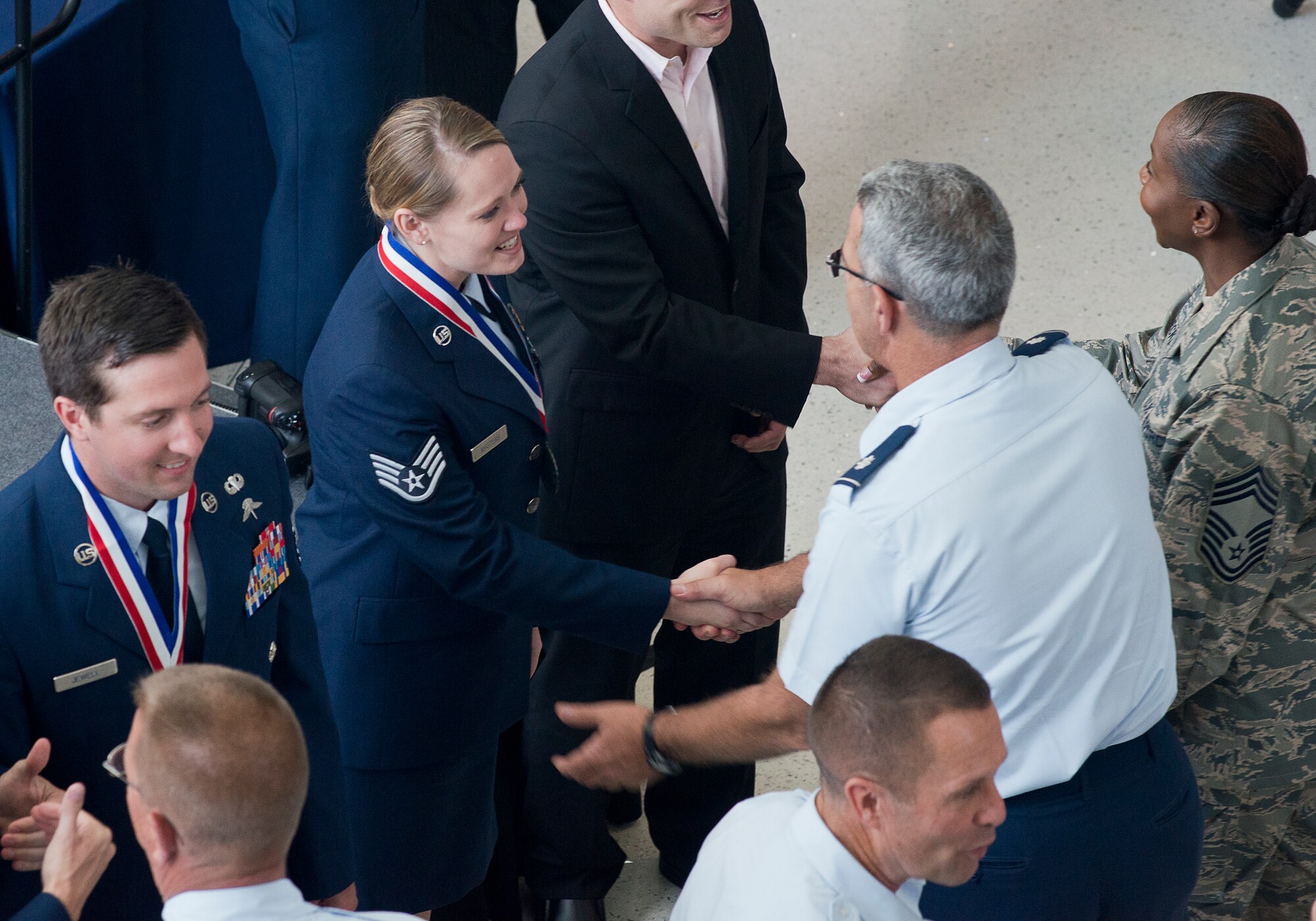 Airmen at the Air National Guard Readiness Center congratulate the ANG's 2016 Outstanding Airmen of the Year during an all-call hosted by Lt. Gen. L. Scott Rice director of the ANG, at the ANGRC on Joint Base Andrews, Md., August 4, 2016. The ceremony was the culmination of the ANG's Focus on the Force Week, a series of events highlighting the importance of professional development at all levels, and the recognition of accomplishments throughout the enlisted corps. The OAY winners are Staff Sgt. Jennifer Masters, Airman of the Year; Tech. Sgt. Nicholas Jewell, Non-Commissioned Officer of the Year; Senior Master Sgt. Mark Farmer, Senior Non-Commissioned Officer of the Year; and Senior Master Sgt. Jack Minaya, First Sergeant of the Year. (U.S. Air National Guard photo by Staff Sgt. John Hillier) 