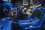 Sailor stands watch in combat information center on dock landing ship USS Harpers Ferry in South China Sea, August 4, 2016, supporting security in Indo-Asia-Pacific region (U.S. Navy/Zachary Eshleman)