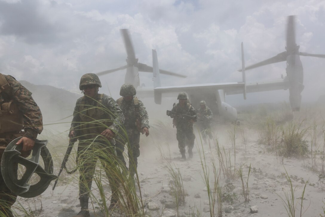 U.S. Marines assigned to Lima Company, 3rd Battalion, 3rd Marine Regiment and Philippine Marines exit an MV-22B Osprey at the Armed Forces of the Philippines Crow Valley training facility in support of Air Assault Support Exercise 16.2, Aug. 6, 2016. The recurrence of the Air Assault Support Exercise each year demonstrates the U.S. and Republic of the Philippines’ commitment to mutual security and our long-time partnership.  (Marine Corps Photo by Lance Cpl. Carl King/Released)