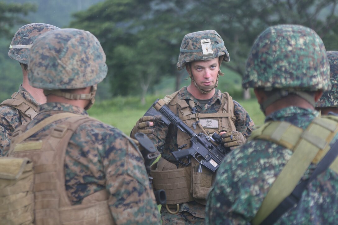 U.S. Marine Corps Capt. Kevin Jones, a San Antonio native, explains Marine Corps infantry tactics to members of the Philippine Marine Corps at the Armed Forces of the Philippines Crow Valley training facility in support of Air Assault Support Exercise 16.2, Aug. 6, 2016. The goal of AASE 16.2 is to maintain the readiness and interoperability of the U.S. and Armed Forces of the Philippines to ensure an effective and rapid response to any contingency in the region. Jones is the company commander of Lima Company, 3rd Battalion, 3rd Marine Regiment. (Marine Corps Photo by Lance Cpl. Carl King/Released)