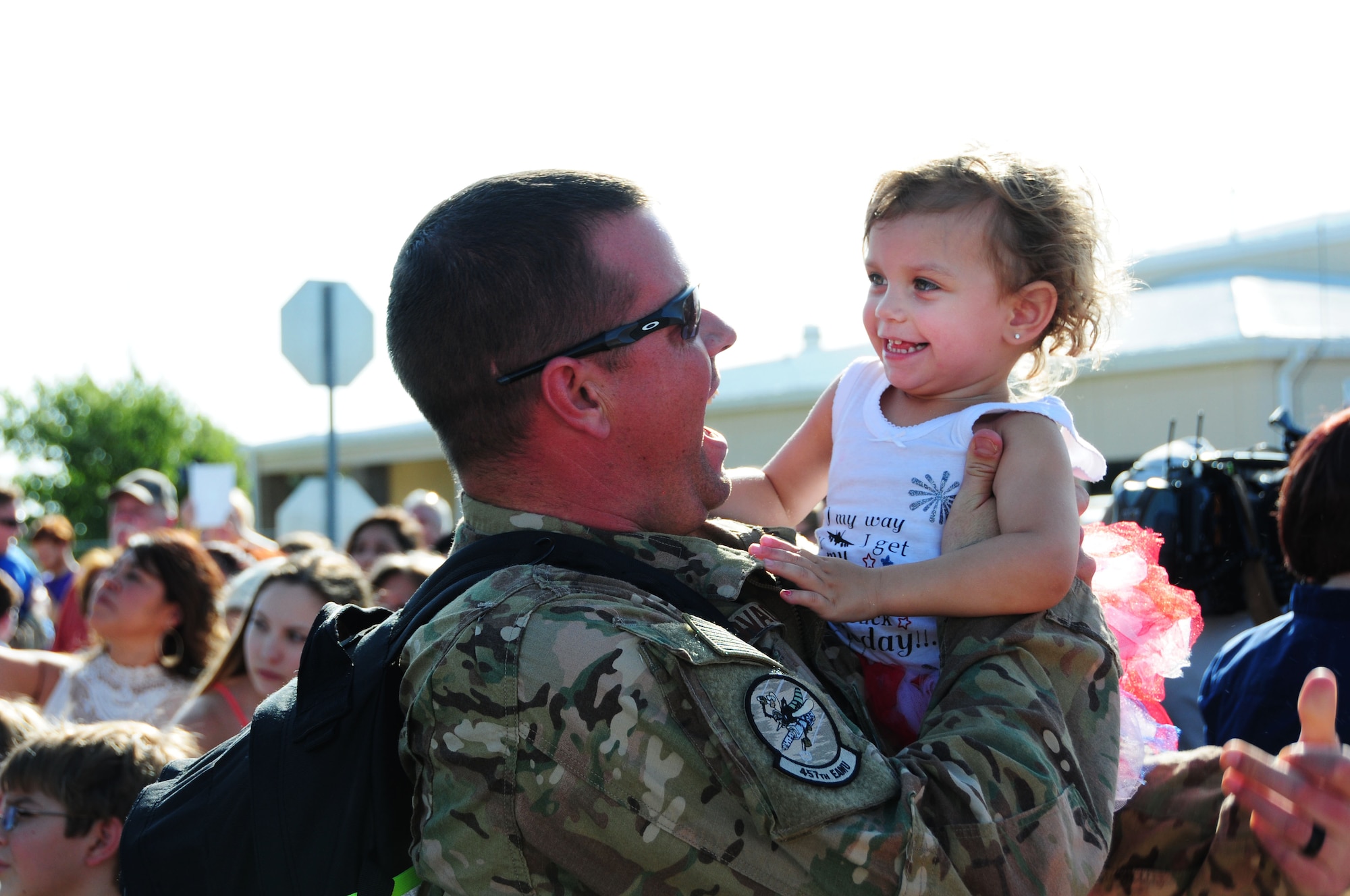 FORT WORTH, Texas - A 301st Fighter Wing Airman greets his daughter Aug. 8 at Naval Air Station Fort Worth Joint Reserve Base during the 301st Fighter Wing Homecoming from Operation Freedom’s Sentinel.  Operation Freedom's Sentinel aims to maintain security and stability in Afghanistan.  (U.S. Navy photo by Mass Communication Specialist 2nd Class Jason Howard/Released)