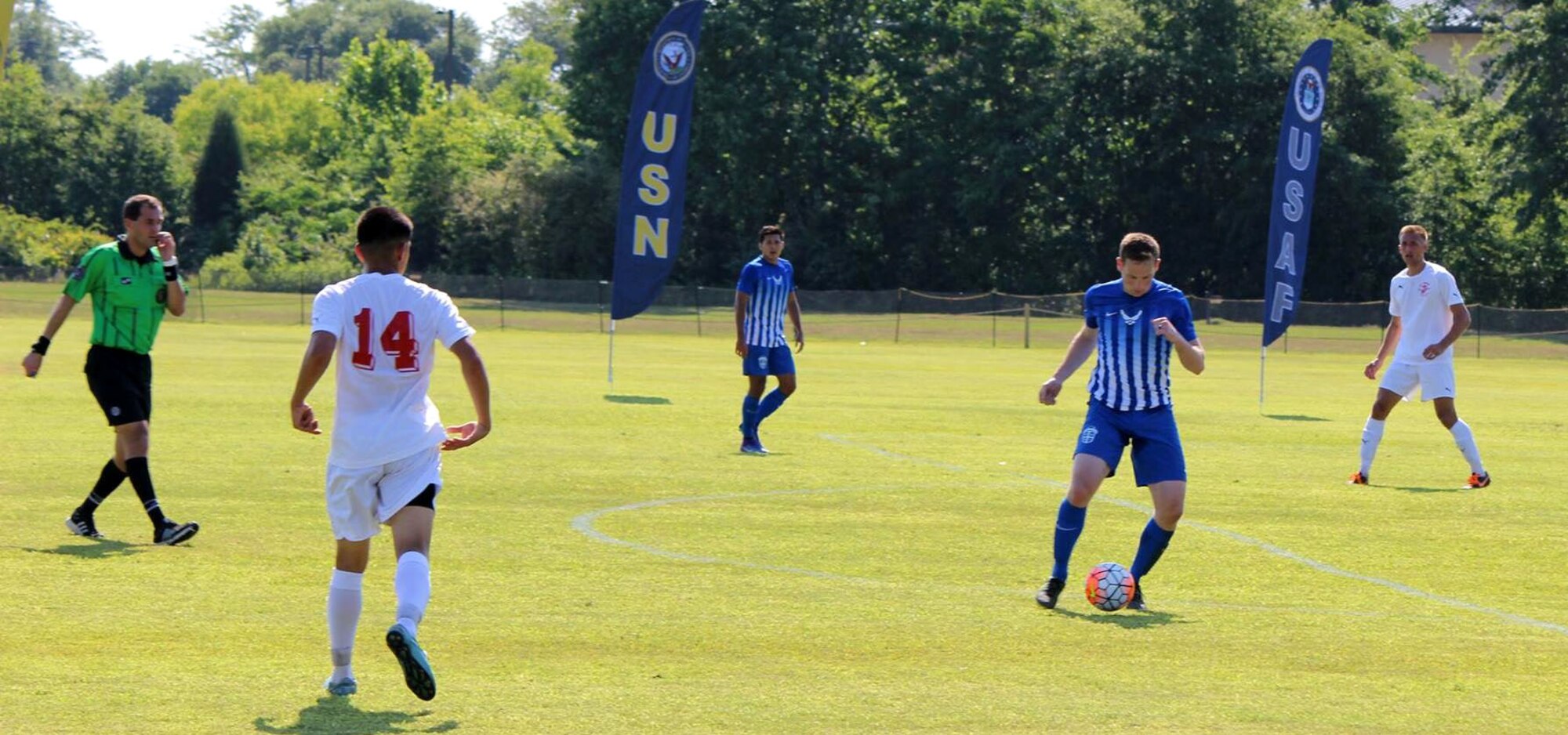 U.S. Air Force 1st Lt. Micah Cummins, pictured with the soccer ball, 100th Air Refueling Wing chief of protocol, has possession of the ball during a game against the Marines at the All-Armed Forces Soccer Championships May 7, 2016, in Columbus, Georgia. Cummins and his team brought home the 13th Gold Medal for the Air Force. (Courtesy photo)