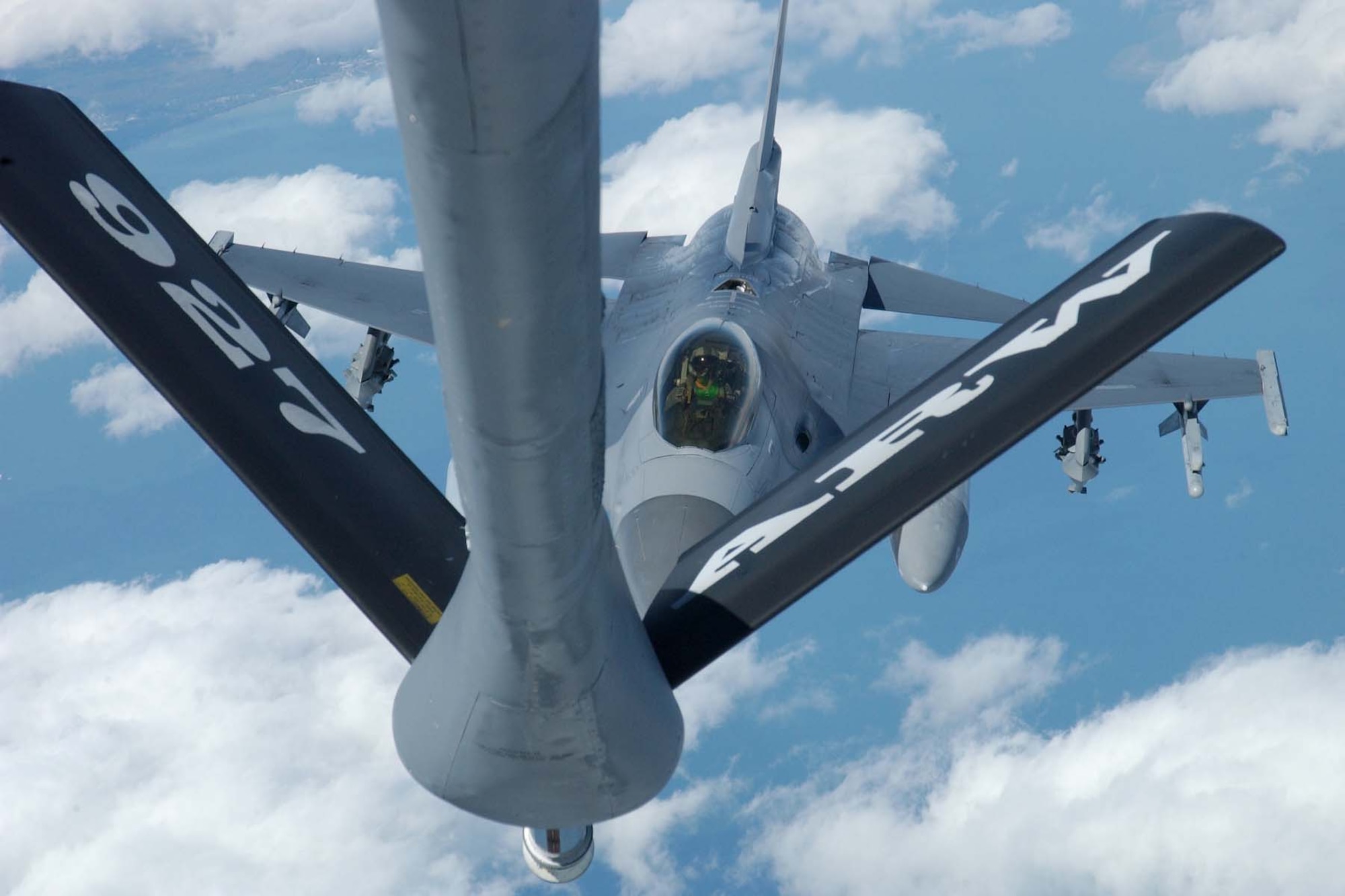 A KC-135R Stratotanker assigned to the 927 ARW prepares to refuel an F-16 Falcon. The 927th ARW and the 6 AMW operate and maintain the 16 KC-135s assigned to MacDill AFB. (Courtesy photo)
