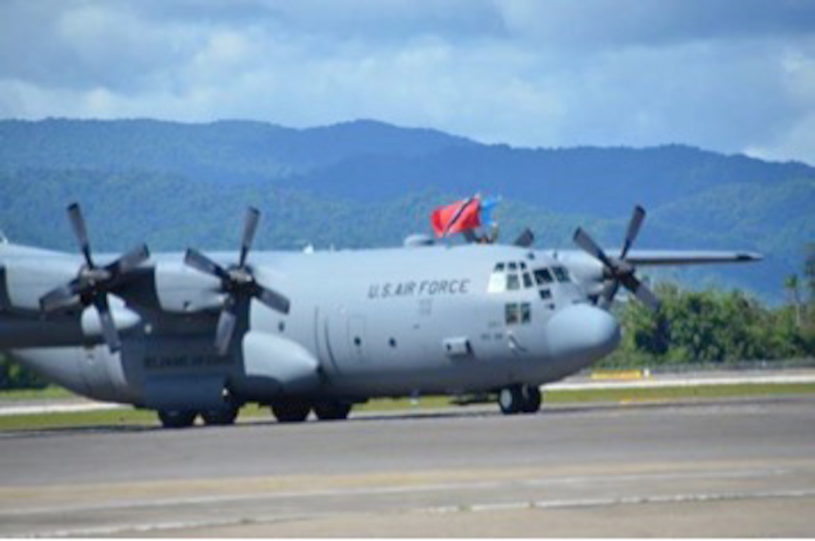 Maj. Gen. Frank Vavala, adjutant general, Delaware National Guard, held the Republic of Trinidad and Tobago and the Delaware state flags upon arrival into the Piarco International Airport on August 7, 2016. 
