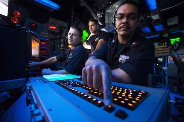 Navy Petty Officer 1st Class Austin Harris mans approach control during flight operations in the air traffic control center of the USS Boxer in the South China Sea, Aug. 8, 2016. The Boxer, the flagship for the Boxer Amphibious Ready Group, with the embarked 13th Marine Expeditionary Unit, is operating in the U.S. 7th Fleet area of operations to support security and stability in the Indo-Asia-Pacific region. Harris is an air traffic controller. Navy photo by Petty Officer  3rd Class Michael T. Eckelbecker