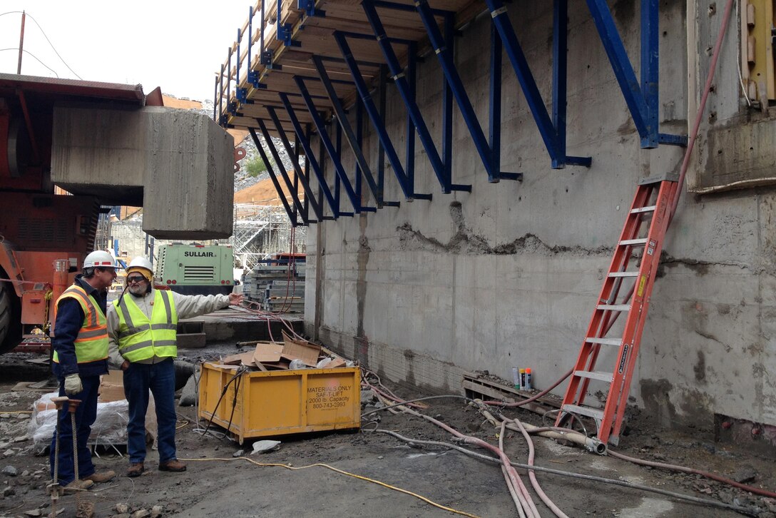 Tony Ellis (Left), Kentucky Lock Addition Project resident engineer, and Jim Niznik, technical lead for the Tennessee Valley Authority, check on the progress of construction of the upstream lock monoliths at the project Nov. 14, 2012. Ellis, 53, passed away July 27, 2016.  Serving on the project since 2000, his leadership and expertise are being recognized for the project's success.