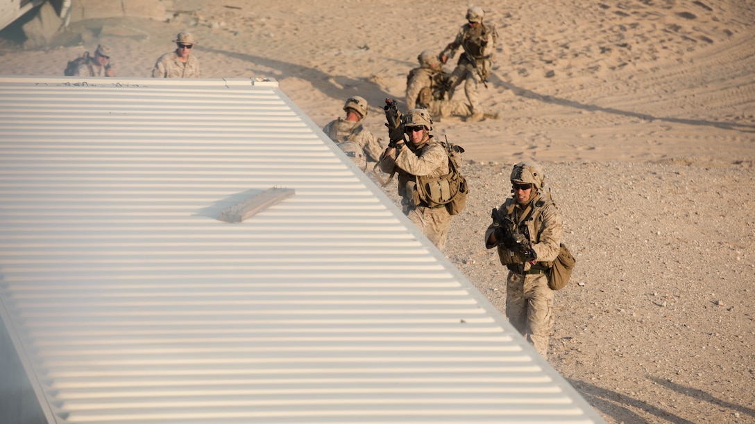 A group of Marines with Kilo Company, 3rd Battalion, 5th Marine Regiment attacking the oppositional force headquarters during the Marine Air Ground Task Force Integrated Experiment 2016 at Marine Corps Air Ground Combat Center Twentynine Palms, Calif. as part of the final course of action for the exercise.  July 31, 2016. The Marines used everything they learn throughout the course of the exercise to secure the enemy headquarters.