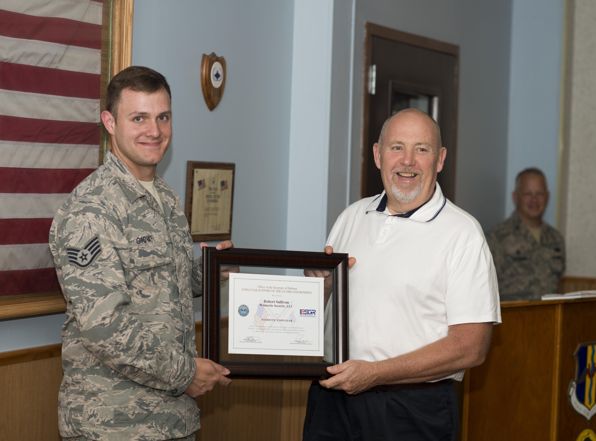 Staff Sgt. Jake Giovati presents his Civilian employer, Lt. Robert Sullivan of Wilmorite Security, Rochester, N.Y., with the ESGR (Employer Support of the Guard and Reserve) Patriot Award. The award is meant to recognize Civilian employers who go above and beyond to support their employees who serve in the Guard and Reserve. August 7, 2016, Niagara Falls Air Reserve Station, N.Y. (U.S. Air Force photo by Tech. Sgt. Stephanie Sawyer) 