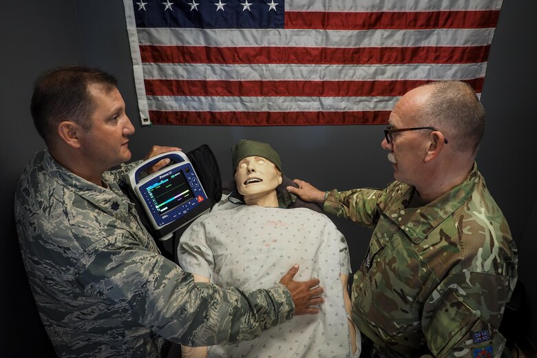 Lt. Col. Michael Mackovich (left) 934th ASTS and Royal Air Force Sgt. Anthony Sanders 612 Royal Air Force Reserve, engages in Critical Care Aeromedical Transport training at Minneapolis-St. Paul Air Reserve Station, Minnesota.