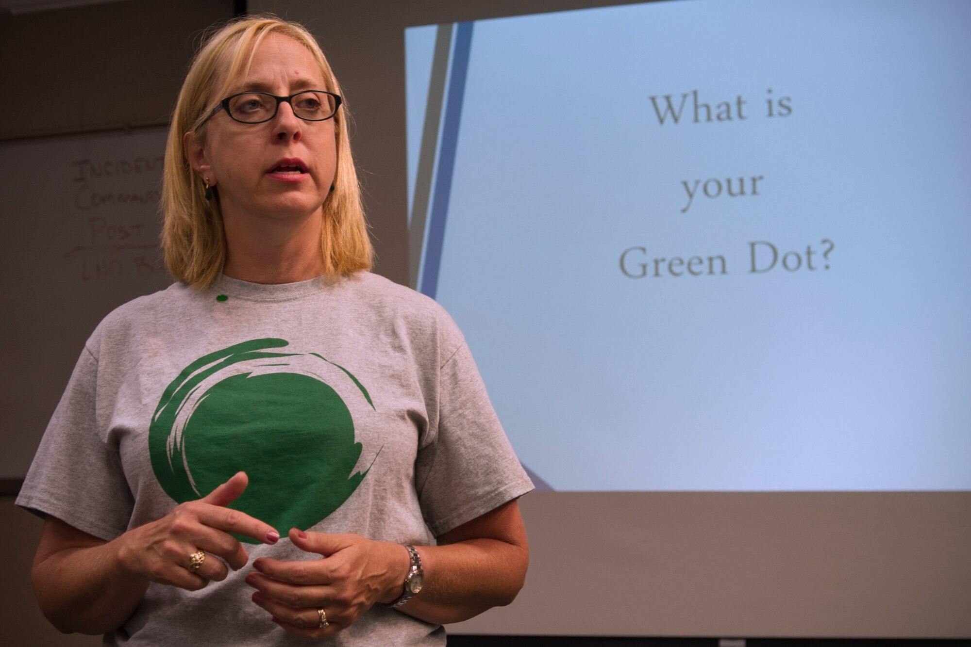Juanita Withrow, 434th Air Refueling Wing drug demand reduction specialist and Green Dot implementer/coordinator discusses strategies to prevent interpersonal violence during Green Dot training at Grissom Air Reserve Base, Ind., Aug. 6, 2016. The Green Dot approach to sexual and domestic violence prevention seeks to educate intolerance of violence as a standard, as well as offering strategies to diffuse situations through directing, delegating and/or distracting. (U.S. Air Force photo/Staff Sgt. Katrina Heikkinen)