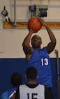 Franklin Eason, 50th Space Wing, puts up a jump shot during a basketball game as part of the Tri-Wing Sports Day at Schriever Air Force Base, Colorado, Friday, Aug. 5, 2016. Eason helped lead the 50th Space Wing basketball team to a 2-0 record and first-place finish in the competition. (U.S. Air Force photo/Brian Hagberg)