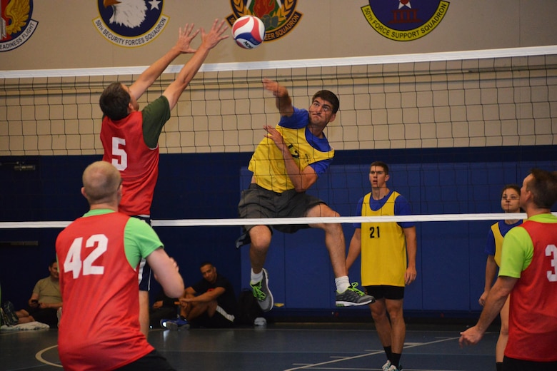 Cory Garcia, 50th Space Wing, goes for a kill during a volleyball game in the Tri-Wing Sports Day at Schriever Air Force Base, Colorado, Friday, Aug. 5, 2016. The 50th Space Wing rolled to a straight set victory over the 460th Space Wing before earning a thrilling three-set win against the 21st Space Wing. (U.S. Air Force photo/Brian Hagberg)