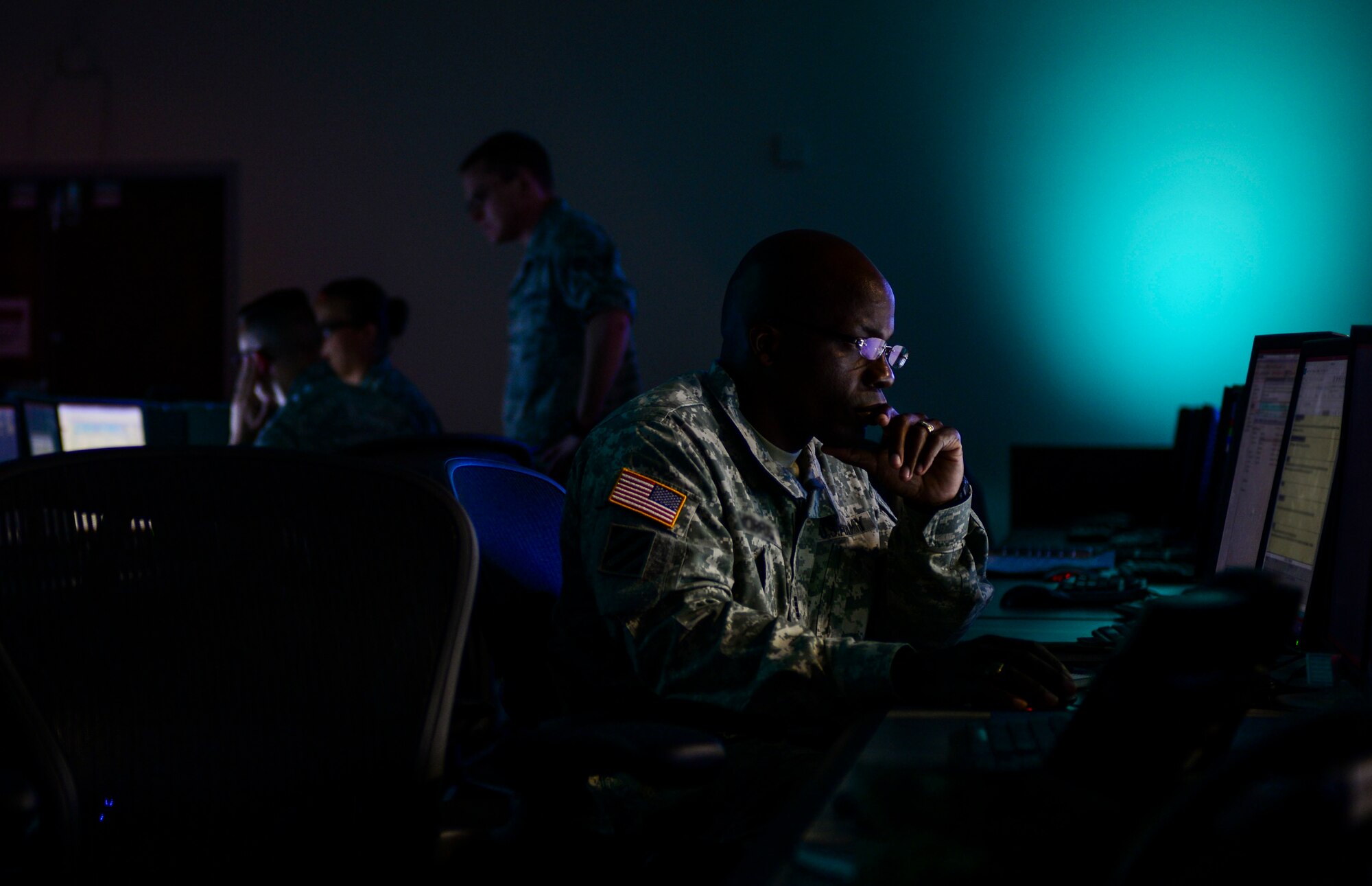 A soldier works at his desk in the mezzanine during a Blue Flag exercise at the 505th Combat Training Squadron at Hurlburt Field, Fla., July 22. The purpose of a Blue Flag exercise is to provide a Numbered Air Force the environment to train as the air and space component of a joint force by planning air and space operations and producing Air Tasking Orders and other supporting products for a given conflict. (U.S. Air Force photo by Airman 1st Class Nathan Byrnes)