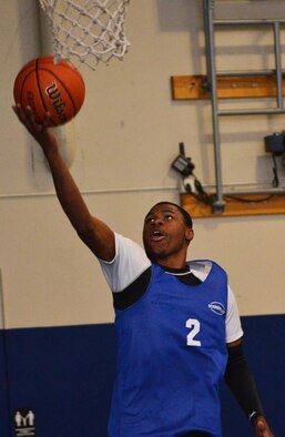 Jonathan Holden, 50th Space Wing, shoots the game-winning lay-up during a basketball game as part of the Tri-Wing Sports Day at Schriever Air Force Base, Colorado, Friday, Aug. 5, 2016. Holden’s shot gave the 50th Space Wing a 2-0 record and first-place finish in the basketball competition for the event. (U.S. Air Force photo/Brian Hagberg)