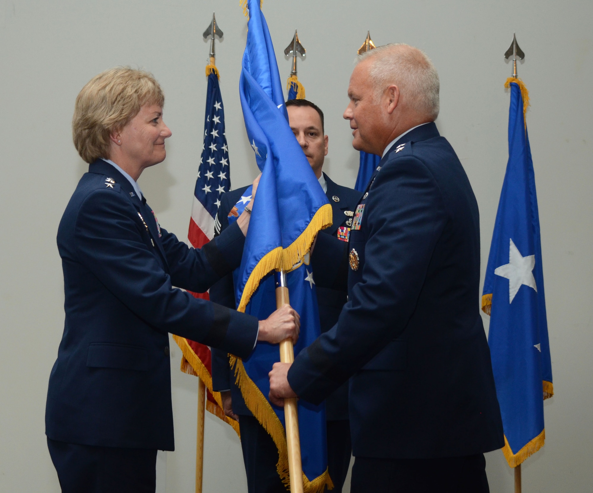 Lt. Gen. Maryanne Miller, Chief of Air Force Reserve, Commander Air Force Reserve Command, hands the guidon for the 22nd Air Force to Maj. Gen. John Stokes, giving him command of the unit during a change of command ceremony in Atlanta, Ga., on Aug. 8, 2016. Stokes assumed command of the 22n AF from Maj. Gen. Stayce Harris.(U.S. Air Force photo/Don Peek)