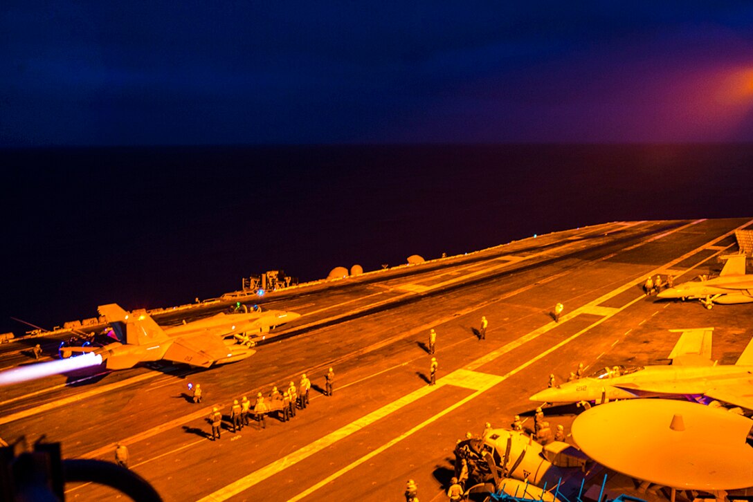 A Navy F/A-18E Super Hornet assigned to Strike Fighter Squadron 137 prepares to launch from the flight deck of the aircraft carrier USS Carl Vinson during night operations in the Pacific Ocean, Aug. 4, 2016. The Carl Vinson was underway with embarked Carrier Air Wing 2 and Destroyer Squadron 1, conducting the Tailored Ship's Training Availability and Final Evaluation Problem to prepare for their upcoming deployment. Navy photo by Seaman Daniel P. Jackson Norgart