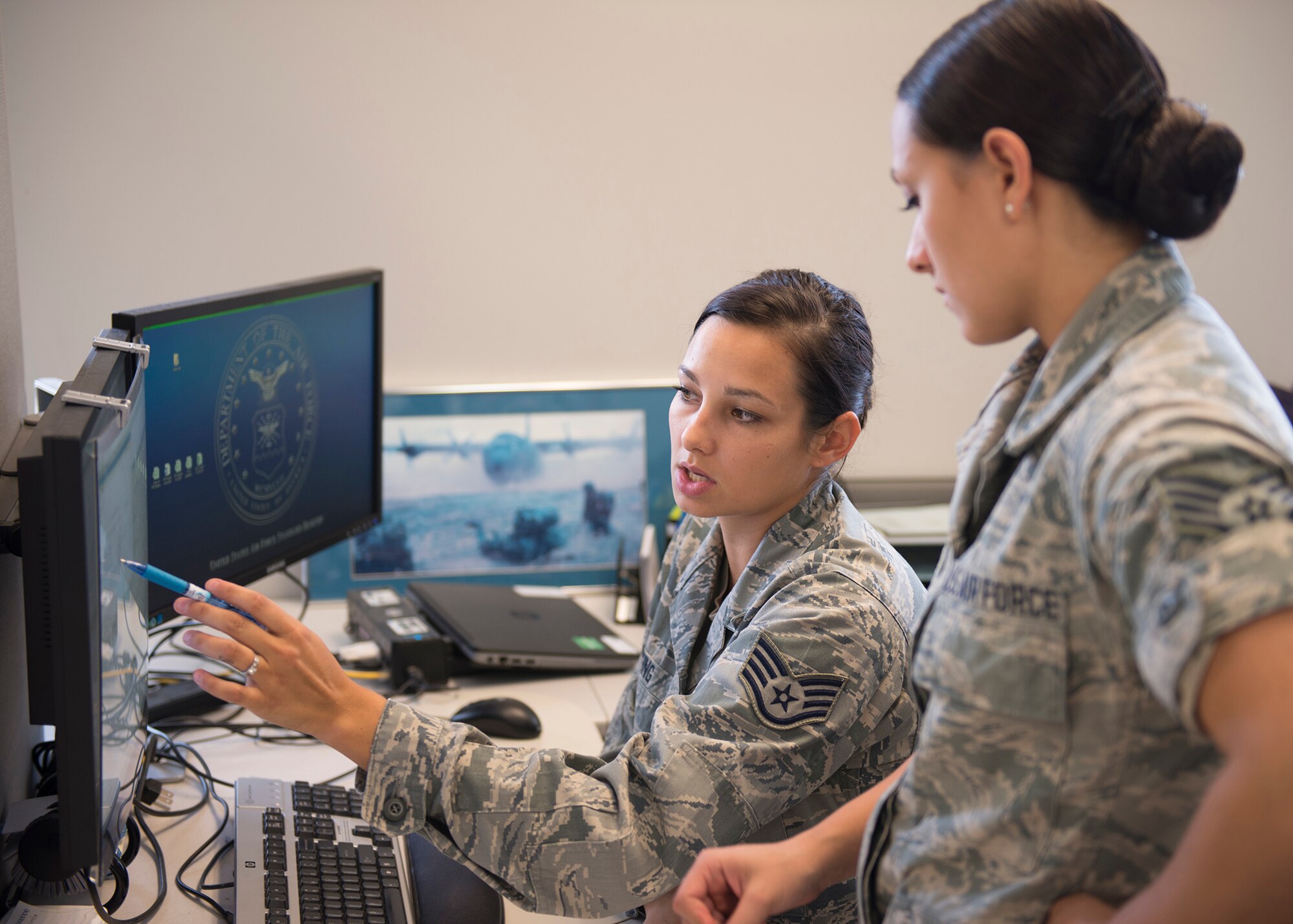 Staff Sgt. Amber Wood and Tech. Sgt. Erica Elking, 919th Special Operations Force Support Squadron, review personnel records Aug. 6 at Duke Field Fla.  (U.S. Air Force photo/Tech. Sgt. Jon McCallum)