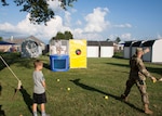 Army Col. Brad Eungard, commander of DLA Distribution Susquehanna, Pa., tries his hand at the dunk tank during Defense Distribution Center Susquehanna’s National Night Out on Aug. 2.