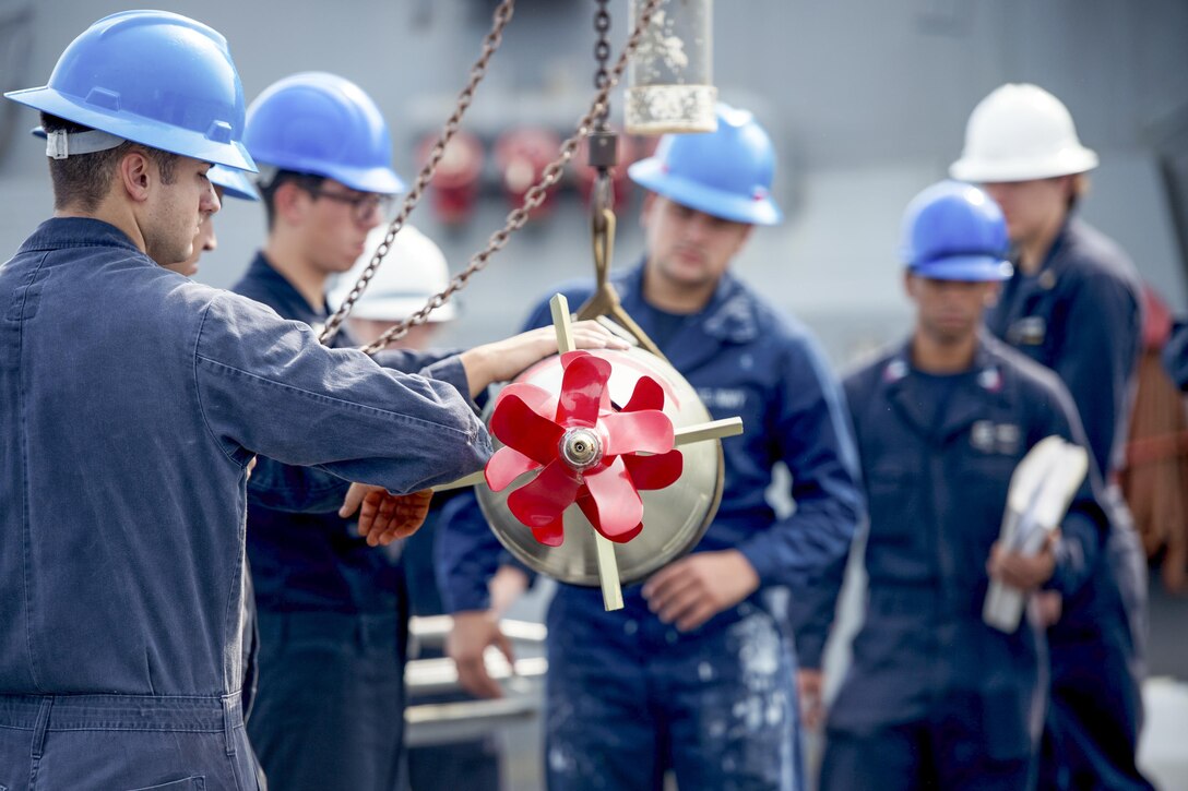 USS Barry sailors move an MK 46 MOD 5A torpedo on the aft missile deck while in the Pacific Ocean, Aug. 4, 2016. The Barry is patrolling in the U.S. 7th Fleet area of operations supporting security and stability in the Indo-Asia-Pacific region. Navy photo by Petty Officer 2nd Class Kevin V. Cunningham