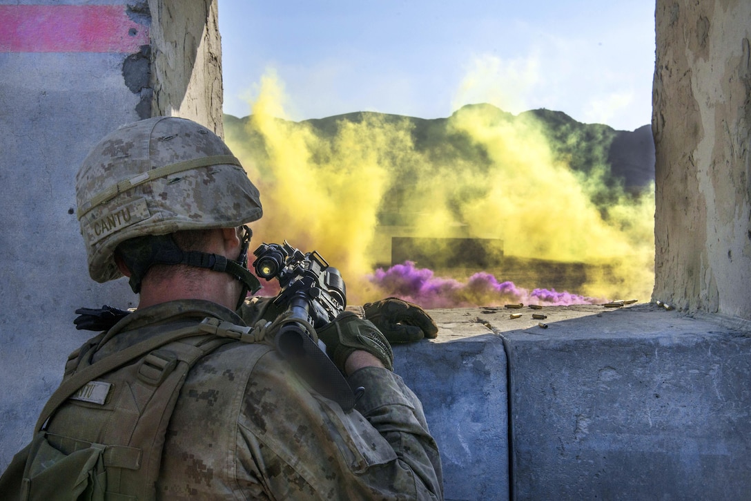 A Marine runs through a scenario during Marine Air Ground Task Force Integrated Experiment 2016 at Marine Corps Air Ground Combat Center Twentynine Palms, Calif., Aug. 5, 2016. The Marine is assigned to Kilo Company, 3rd Battalion, 5th Marine Regiment. During the five-day experiment, the Marines tested new equipment and concepts to help the Marine Corps meet the challenges of future operating environments. Marine Corps photo by Cpl. Thor J. Larson