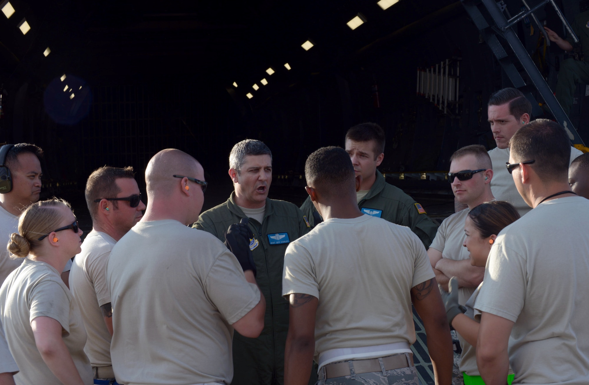 Master Sgt. Jeff Stanley, a load master with the 9th Airlift Squadron at Dover Air Force Base (AFB), Del., provides Airmen a mission safety brief at Ellsworth AFB, S.D., Aug. 2, 2016. Approximately 650 tons of equipment is being transported to Andersen AFB, Guam, in support of the continuous bomber presence mission. (U.S. Air Force photo by Airman Donald Knechtel)