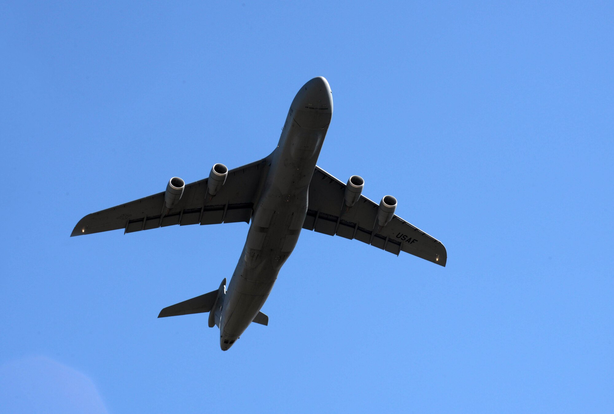 A fully loaded C-5 Galaxy from Travis Air Force Base (AFB), Calif., departs from Ellsworth AFB, S.D., Aug. 4, 2016. More than 650 tons of equipment are being transported to Guam in support of U.S. Pacific Command’s continuous bomber presence mission. (U.S. Air Force photo by Airman Donald Knechtel) 