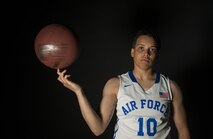 Senior Airman Avery Hale, 5th Maintenance Squadron aerospace ground equipment journeyman,spins a basketball on her finger in her Air Force basketball uniform at Minot Air Force Base, N.D., Aug. 8, 2016. Hale grew up playing basketball, and now plays for the U.S. Air Force women's team. (U.S. Air Force photo/Airman 1st Class Christian Sullivan)