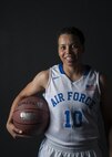 Senior Airman Avery Hale, 5th Maintenance Squadron aerospace ground equipment journeyman, holds a basketball in her Air Force basketball uniform at Minot Air Force Base, N.D., Aug. 8, 2016. Hale grew up playing basketball, and now plays for the U.S. Air Force women's team. (U.S. Air Force photo/Airman 1st Class Christian Sullivan)