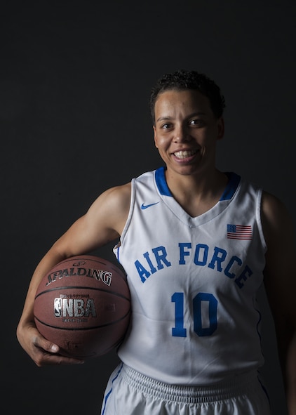 Senior Airman Avery Hale, 5th Maintenance Squadron aerospace ground equipment journeyman, holds a basketball in her Air Force basketball uniform at Minot Air Force Base, N.D., Aug. 8, 2016. Hale grew up playing basketball, and now plays for the U.S. Air Force women's team. (U.S. Air Force photo/Airman 1st Class Christian Sullivan)