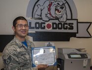 Staff Sgt. Eliaser Martinez, 5th Medical Support Squadron Squadron NCO in charge of storage and distribution, accepts an Own It award at Minot Air Force Base, N.D., Aug. 5, 2016. Martinez consistently surpassed all expectations as a logistics technician. Martinez’s unwavering dedication and team spirit demonstrates that he “Owns It” every day. (U.S. Air Force photo/Airman 1st Class Christian Sullivan)