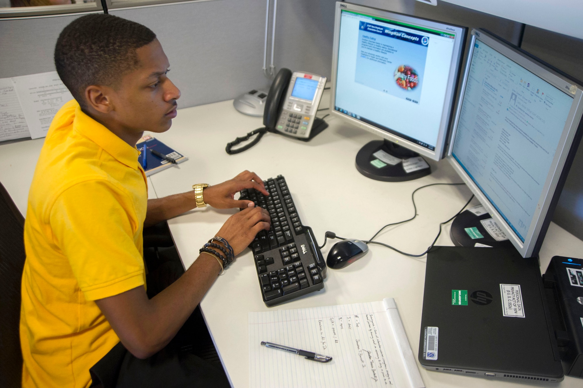 Jonathan Beckett a Summer Pathways intern at Joint Base Andrews, Md., responds to an email from his workstation. Beckett is currently interning at the Air Force District of Washington Financial Management section.(Photo by U.S. Air Force Senior Master Sgt. Adrian Cadiz)(Released)