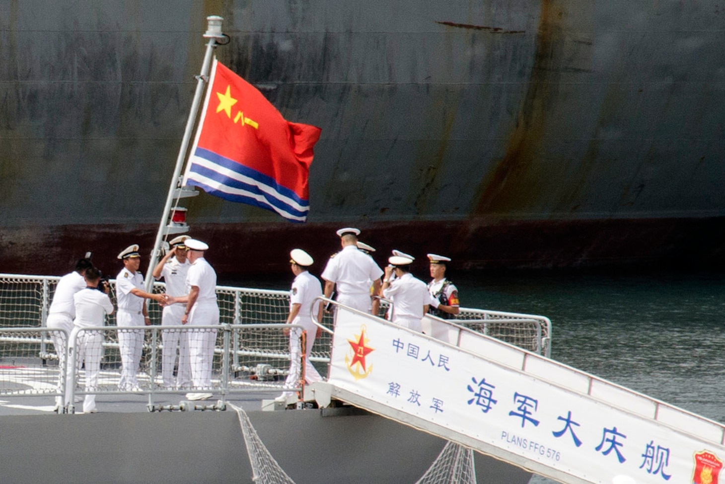 Adm. Scott Swift, commander of U.S. Pacific Fleet, is welcomed aboard the People's Liberation Army Navy (PLA(N)) Jiangkai II class frigate Daqing (FFG 576) by Vice Adm, Aug 9, 2016.  Yuan Yubai, commander of the PLA(N) North Sea Fleet. Swift is visiting Qingdao in conjunction with USS Benfold's (DDG 65) ongoing port call, which aims to advance maritime cooperation between the two navies while enhancing relationships between sailors. 