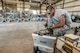 Senior Airman Cameron Kidd, 325th Maintenance Squadron, Tyndall Air Force Base, Fla., readies equipment for loading GPS data into GBU-32 bomb tail sections Aug. 2 at Hill AFB, Utah. The bombs will be dropped at the Utah Test and Training Range during the air-to-ground exercise known as Combat Hammer. Combat Hammer tests precision weapons for performance and suitability for combat. (U.S. Air Force photo by Paul Holcomb)