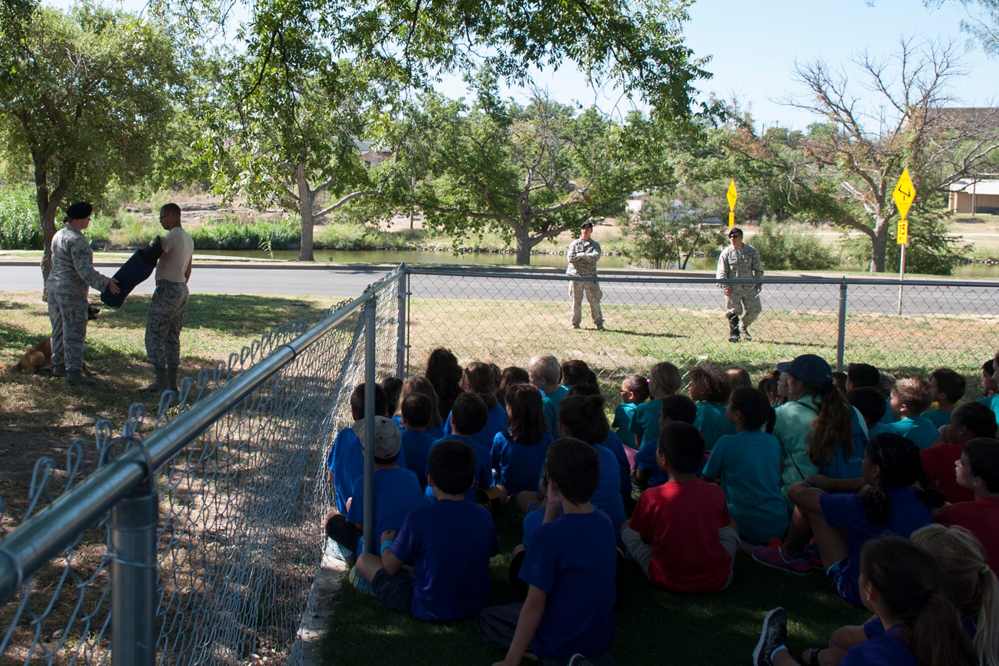 U.S. Air Force Senior Airman Hailey Slenk, 17th Security Forces Squadron military working dog handler, and Joy, 17th SFS MWD, perform a search on Senior Airman Gage Reece, 17th SFS patrolman, during a demonstration at the YMCA, San Angelo, Texas, Aug. 3, 2016. The 17th SFS MWD unit held the demonstration to support community relations between Goodfellow Air Force Base and San Angelo. (U.S. Air Force photo by Staff Sgt. Laura R. McFarlane/Released) 