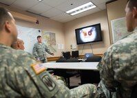 U.S. Air Force Tech. Sgt. William Henry, the 527th Space Aggressor Squadron (SAS) adversary intelligence flight noncommissioned officer in charge, assigned to Schreiver Air Force Base, Colo., briefs U.S. Army Soldiers from Joint Base Elmendorf-Richardson, Alaska, on the capabilities of enemy GPS interference Aug. 8, 2016, during RED FLAG-Alaska 16-3, at Eielson Air Force Base, Alaska. The 527th SAS works with units to teach enemy capabilities and ways to combat the interference of GPS weapon systems during engagements. (U.S. Air Force photo by Staff Sgt. Shawn Nickel) 