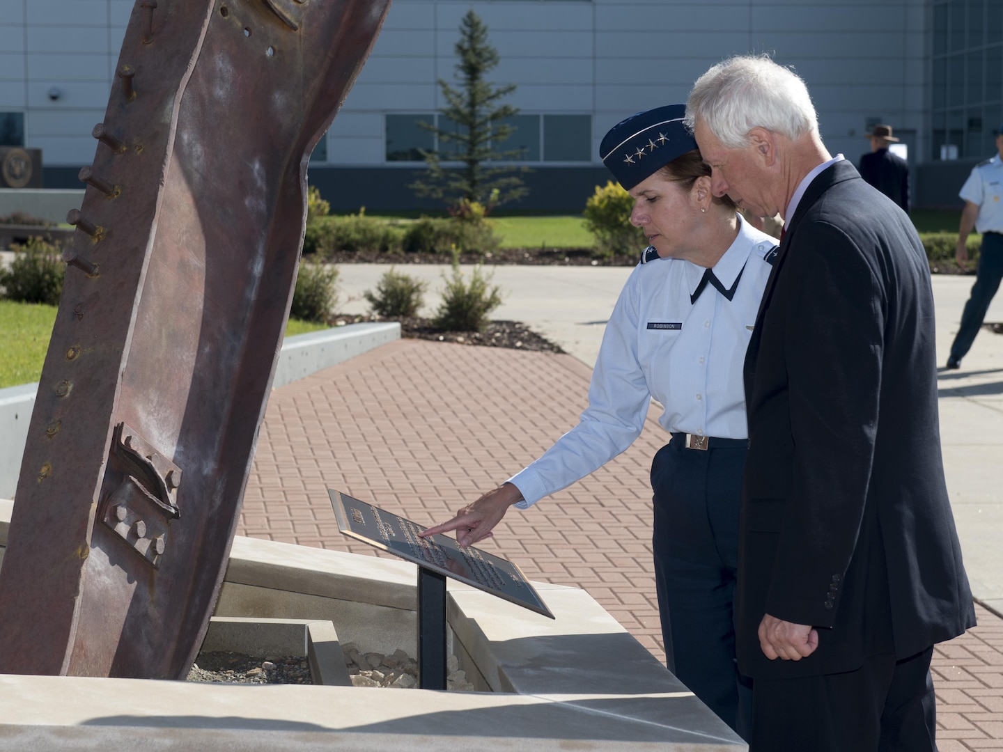 NORAD and USNORTHCOM Commander, Gen. Lori Robinson and the Honourable Stéphane Dion, Canadian Minister of Foreign Affairs, pause in front of the 9/11 Memorial at the headquarters prior to the Minister receiving briefings on the commands’ missions during his visit to Peterson Air Force Base, in Colorado Springs, Colorado, August 8, 2016.