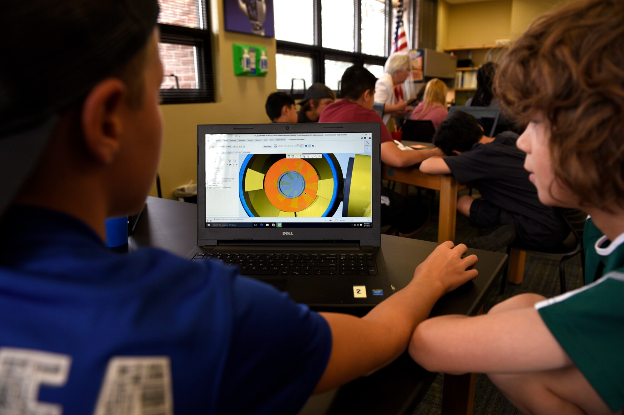 Joe Christ, 12, and Jonah Illsley, 11, work together on a submarine engineering project using computer software at a STEM Camp on Peterson Air Force Base, Colo., Aug. 4, 2016. The camp partnership with the STARBASE Academy and Colorado 4-H brought together students from around the country to learn about science, technology, engineering and mathematics. (U.S. Air Force photo by Senior Airman Rose Gudex)