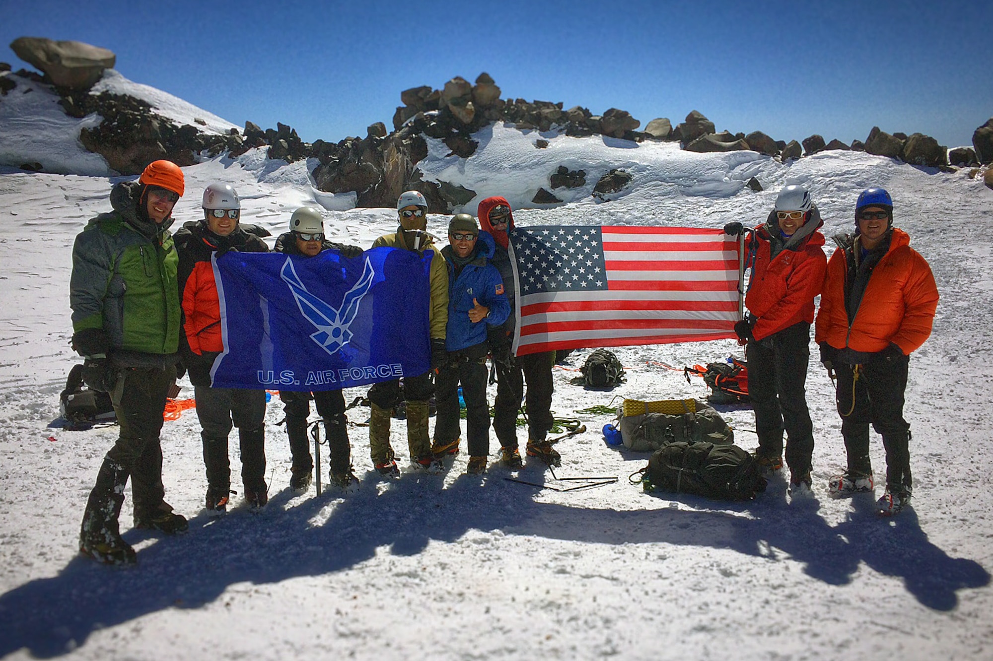 Members of the U.S. Air Force 50 Summits Challenge pose for a photo July 23, 2016, at the summit of Mount Rainier, Wash. Eight climbers from Joint Base Lewis-McChord summited the mountain to complete the summit challenge for Washington. (Courtesy photo) 