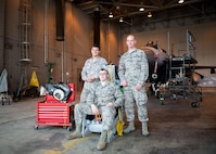 U.S. Air Force Staff Sgt. Corey Holt and Senior Airman Shane Sells, both assigned to the 8th Maintenance Squadron, Kunsan Air Base (AB) Republic of Korea, and Staff Sgt. Corey Holt, assigned to the 35th Maintenance Squadron, Misawa AB, Japan, all aircrew egress systems technicians, work together to install an ejection seat that was proving to be difficult to bolt-in on an F-16D Fighting Falcon aircraft Aug. 9, 2016, during RED FLAG-Alaska 16-3 at Eielson Air Force Base, Alaska. By working together, even though they are from different bases in the Indo-Asia-Pacific, they saved 50 percent on man-hours and sharpened their combat skills by working in the exercise aimed at creating a realistic threat environment at simulated forward operating bases. (U.S. Air Force photo by Staff Sgt. Shawn Nickel)