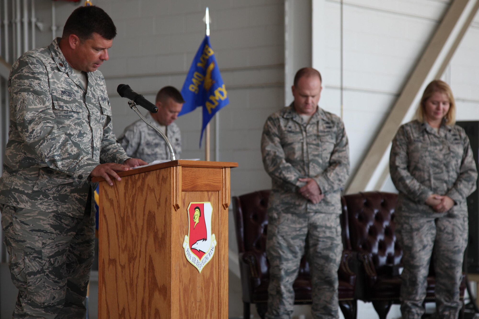 Major Jason Bredeson, 940th Air Refueling Wing Chaplain, says the opening prayer during the 940th Air Refueling Squadron assumption of command ceremony held August, 6 2016 at Beale Air Force Base, California. Col. Aaron Heick, 940th Maintenance Group commander, presided over the ceremonies as Lt. Col. Paula Ross assumed command of the 940 AMXS. (U.S. Air Force photo by Tech. Sgt. Kenneth McCann/Released)