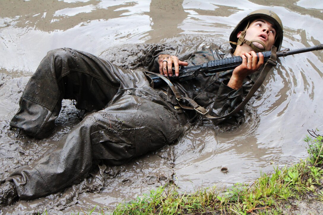 A Marine assigned to Marine Corps Field Medical Training Battalion East participates in an obstacle course on Camp Lejuene, N.C., Aug. 1, 2016. The course tests a student's strength and ability to safely move past obstacles. Marine Corps photo by Maria Kirk
