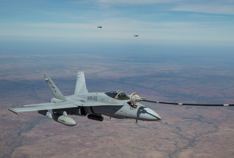 An F/A-18C Hornet with Marine Fighter Attack Squadron (VMFA) 122 conducts an aerial refueling with Marine Aerial Refueler Transport Squadron (VMGR) 152 during Exercise Pitch Black 2016 at Royal Australian Air Force Base Tindal, Australia, Aug. 9, 2016. VMGR-152 provides aerial refueling and assault support during expeditionary and joint or combined operations like Pitch Black. This exercise is a biennial, three week, multinational, large-force training exercise hosted by RAAF Tindal. (U.S. Marine Corps photo by Cpl. Nicole Zurbrugg)