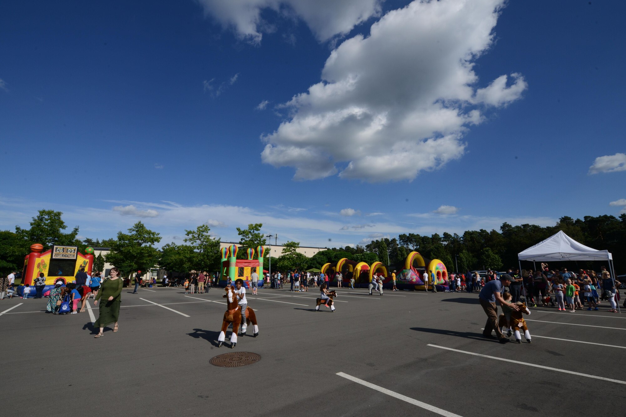 Department of Defense members and their families attend a block party Aug. 5, 2016, at Ramstein Air Base, Germany. The Ramstein Enlisted Club sponsored the event, which was open to all DOD cardholders and their families with base access. (U.S. Air Force photo/ Airman 1st Class Joshua Magbanua)