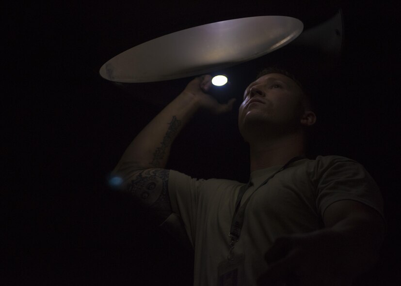 Staff Sgt. Joshua Jorgensen, 455th Expeditionary Aircraft Maintenance Squadron C-130J Super Hercules flying crew chief, performs an intake and exhaust inspection, Bagram Airfield, Afghanistan, Aug. 8, 2016. Tactical aircraft maintenance technicians otherwise known as crew chiefs perform thru-flight inspections that include checking the intake and exhaust for oil, crakes and loose hardware. (U.S. Air Force photo by Senior Airman Justyn M. Freeman)