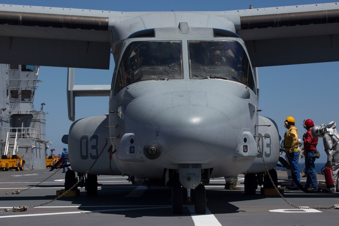 Flight deck crew members with the BPC Dixmude prepare to refuel an MV-22B Osprey with Marine Medium Tiltrotor Squadron 266, Special Purpose Marine Air-Ground Task Force-Crisis Response-Africa, as part of bilateral training in the Gulf of Cadiz, Spain, Aug. 6, 2016. The Dixmude served as a platform to assist SPMAGTF-CR-AF in maintaining their readiness by hosting carrier qualification training. (U.S. Marine Corps photo by 1stLt. John McCombs.)