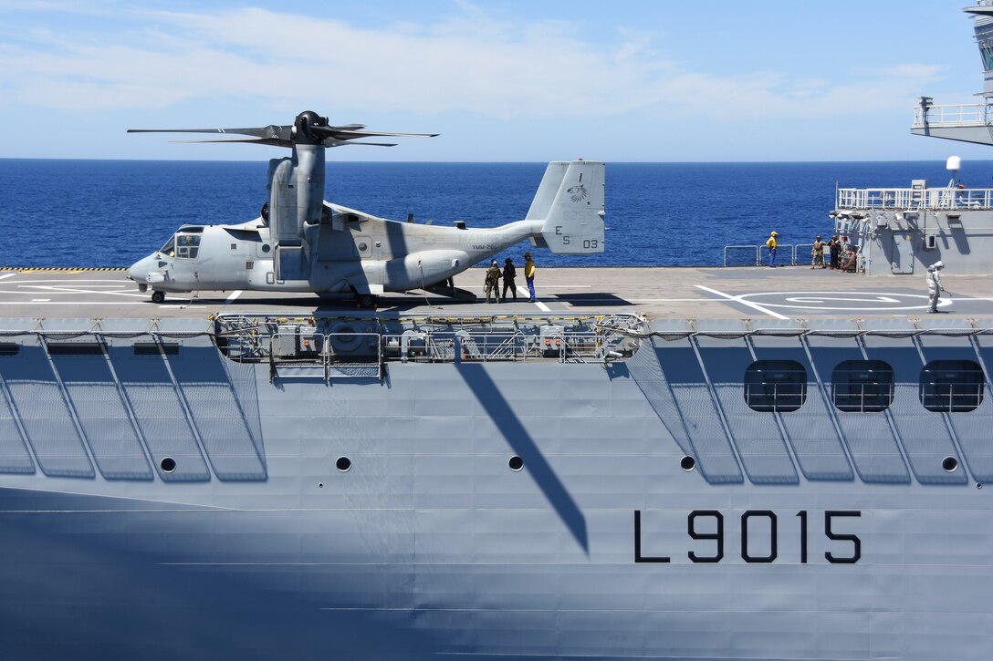 An MV-22B Osprey with Marine Medium Tiltrotor Squadron 266, Special Purpose Marine Air-Ground Task Force-Crisis Response-Africa, lands onboard the BPC Dixmude as part of bilateral training in the Gulf of Cadiz, Spain, Aug. 6, 2016. The Dixmude served as a platform to assist SPMAGTF-CR-AF in maintaining their readiness by hosting carrier qualification training. (Courtesy photo provided by Lt. Cmdr. Florian Edus)