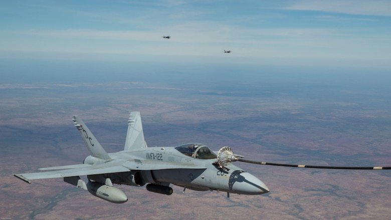 An F/A-18C Hornet with Marine Fighter Attack Squadron 122 conducts an aerial refueling with Marine Aerial Refueler Transport Squadron 152 during Exercise Pitch Black 2016 at Royal Australian Air Force Base Tindal, Australia, Aug. 9, 2016. VMGR-152 provides aerial refueling and assault support during expeditionary and joint or combined operations like Pitch Black. This exercise is a biennial, three week, multinational, large-force training exercise hosted by RAAF Tindal. 