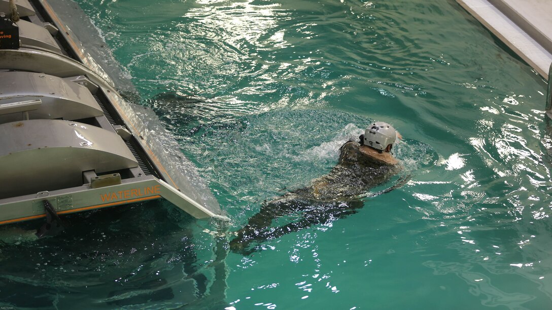 Lance Cpl. Baeden Harrison with Combat Logistics Battalion 24 saftley egresses from the Helo Dunker to help prepare and imbue him with the skills and confidence too successfully and safely egress out of a helicopter that has suffered a controlled or uncontrolled landing within a body of water at the Water Survival training facility on Marine Corps Base Camp Lejeune, N.C. Aug. 5, 2016. The Marines undertook the training which is designed as a lifesaving course that provides service members with the skills and confidence too successfully and safely egress out of a helicopter that has suffered a controlled or uncontrolled landing within a body of water. 