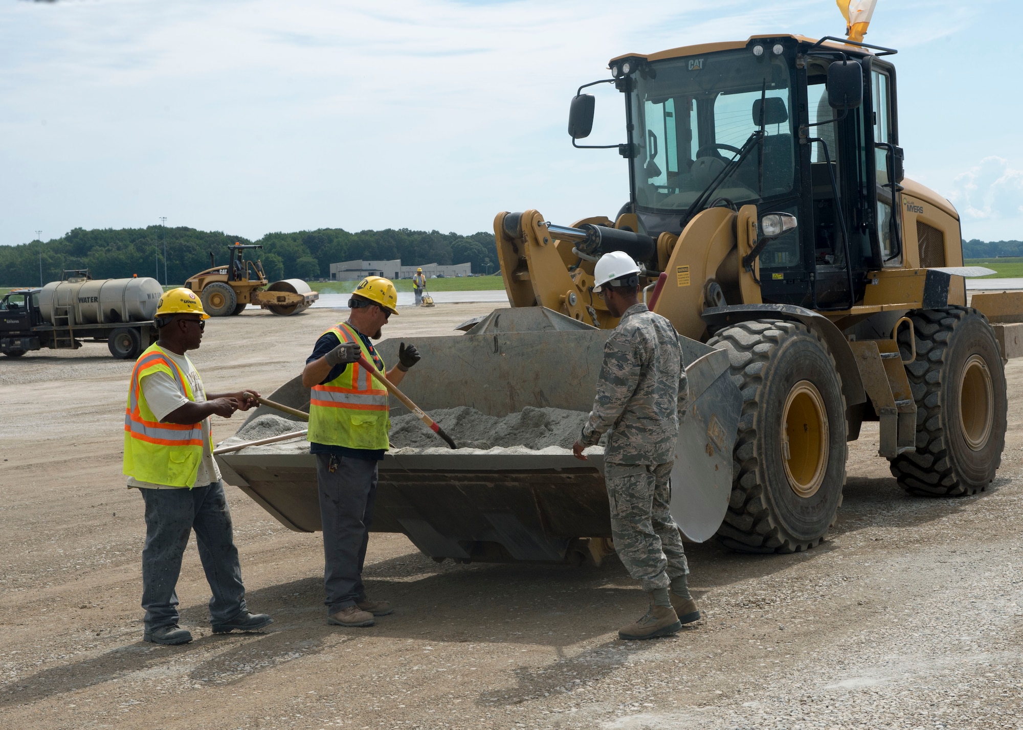 1st Lt. Prince Chavis, civil engineer officer with the 822nd Civil Engineer Flight, discusses runway construction with contractors Aug. 8, 2016, Dover Air Force Base, Del. The under construction runway was constructed in 1943 and normally serves as Dover’s primary runway for large cargo aircraft. 
