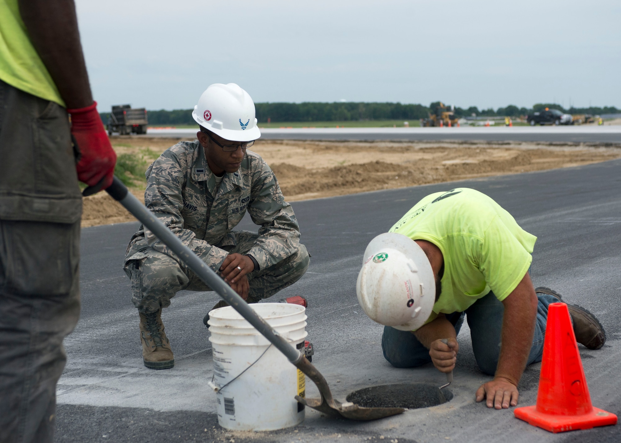 1st Lt. Prince Chavis, civil engineer officer with the 822nd Civil Engineer Flight, observes contractors working on a runway’s instrument controlled landing system Aug. 8, 2016, Dover Air Force Base, Del.  Instrument controlled landing systems are often used when aircraft land in inclement weather situations.